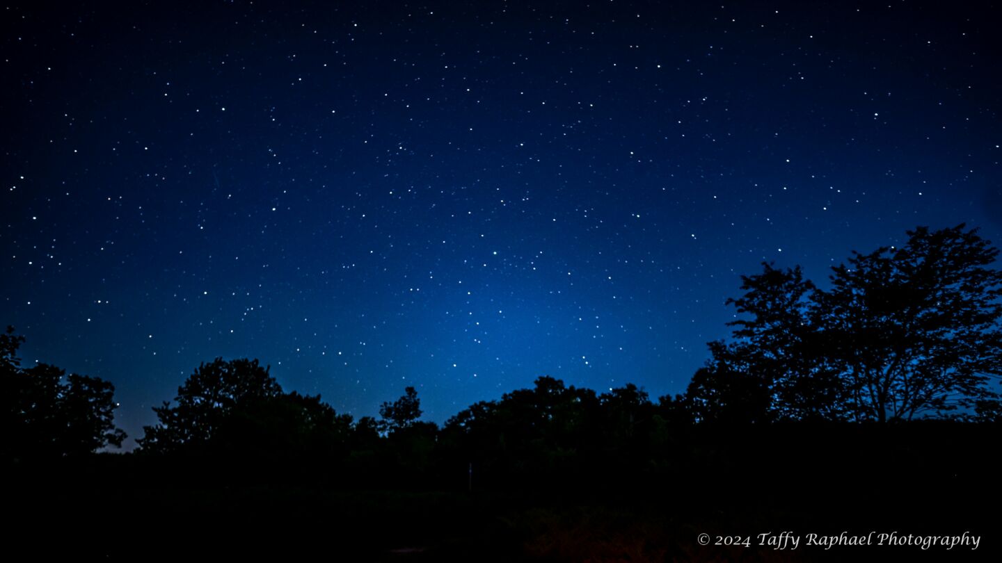 Night sky’s blue horizon during the moon set taken from within the Beaver Island State Wildlife Research Area Dark Sky Sanctuary.