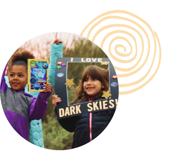 Photo of children holding signs reading